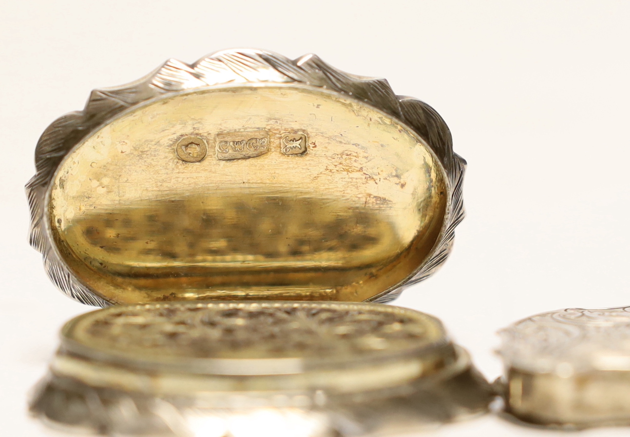 A Victorian engraved silver cartouche shaped vinaigrette, Cronin & Wheeler, Birmingham, 1846, 40mm and other other smaller silver vinaigrette, Francis Clark, Birmingham, 1840.